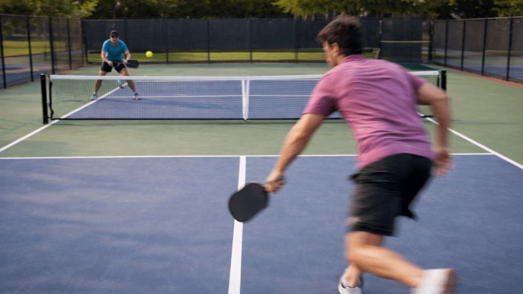 Pickleball player rushing forward at midcourt during a rally