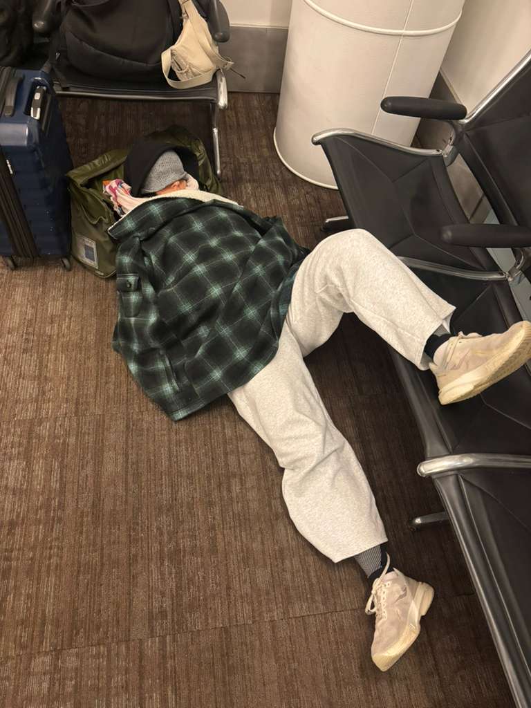 Professional pickleball player sleeping at airport during travel delay