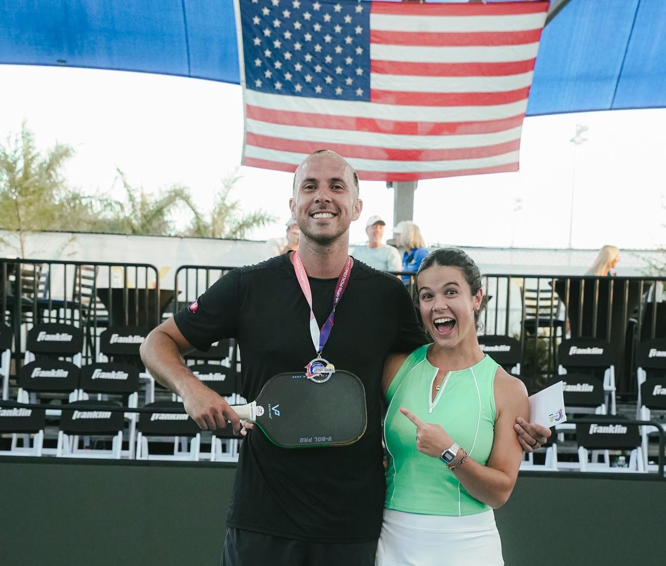Pro pickleball players celebrating a medal finish at the US Open Championships